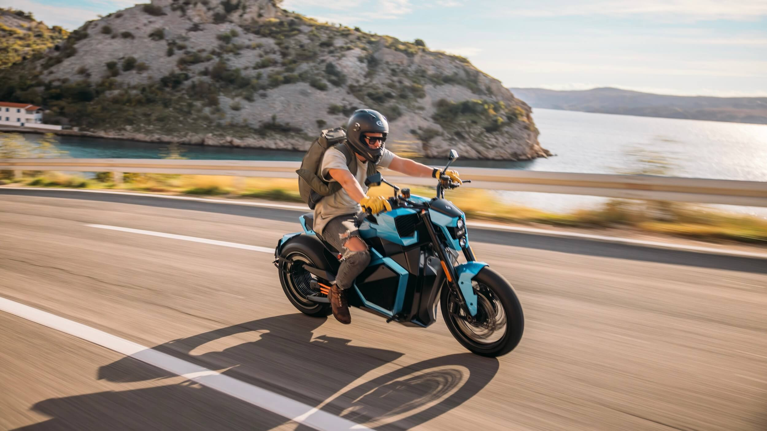 A man with a backpack riding a blue electric motorcycle in Croatia.