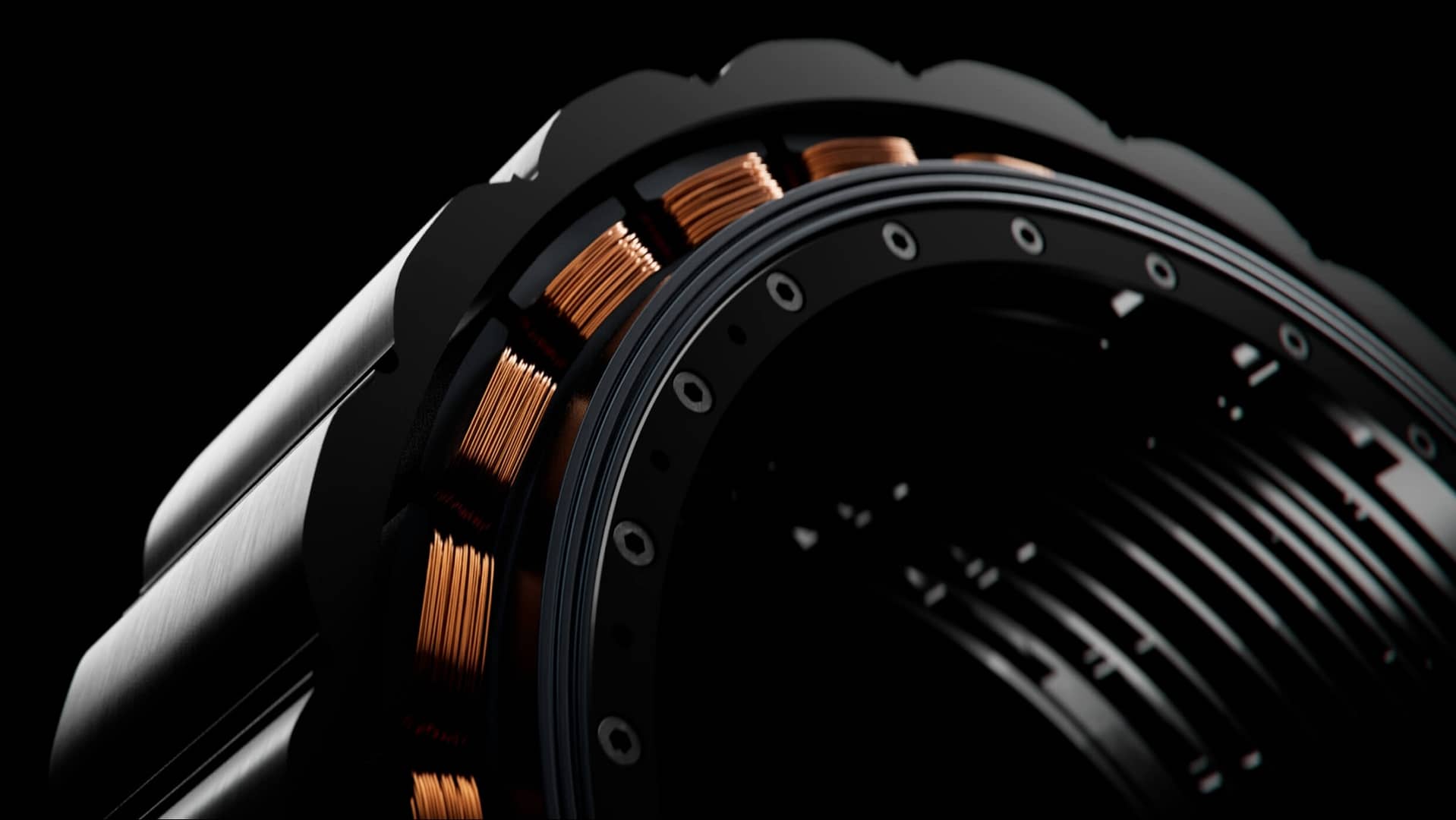 Close-up of a mechanical component with copper coils arranged circularly around a dark, ridged surface. The coils are enclosed within a black metal casing, and the background is a solid black, emphasizing the intricate structure.