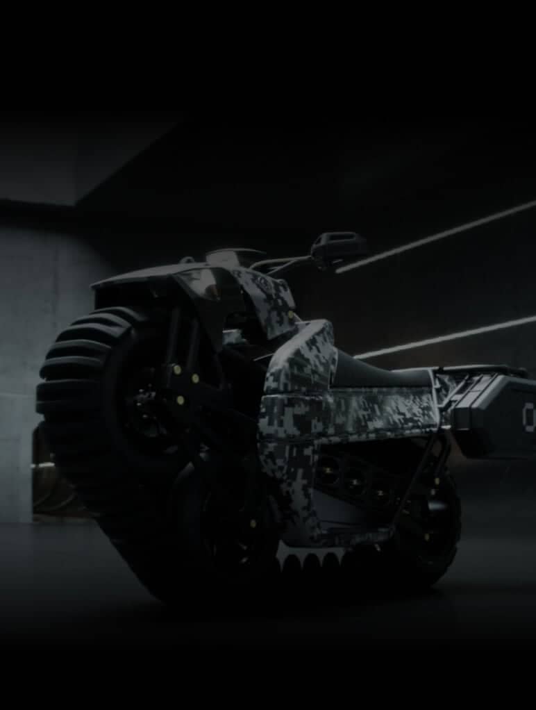 A futuristic motorcycle with a digital camouflage pattern is parked indoors. The design features large, rugged tires and a sleek, angular body. The setting is dimly lit, highlighting the vehicle's unique contours and texture.